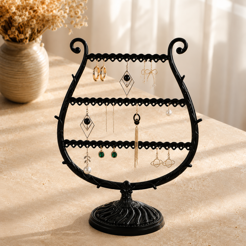 presentoir a boucles d'oreilles trois niveaux (Noir) avec vase de fleurs sechees en arriere-plan